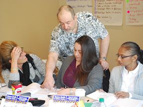 WHSC instructor helps small group of participants in JHSC Certification training class