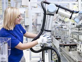 Worker operating industrial robot