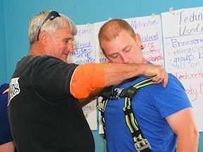 WHSC instructor works closely with participant in Working at Heights training