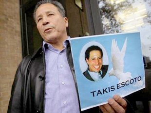 Ramiro Escoto holds a photo of his son, Takis Escoto, who was killed on a Windsor construction site
