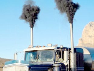 A truck billowing out diesel engine smoke