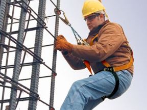 Worker working safely at heights