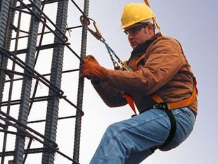 Worker wearing a safety harness