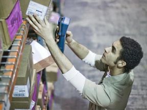 Warehouse worker scans an item