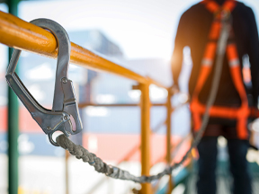 Workers working at heights with proper safety equipment