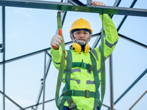 Worker working safely at heights after completing WHSC training