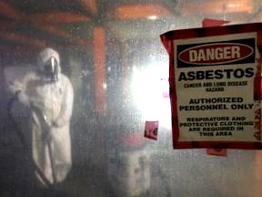 Workers removing asbestos