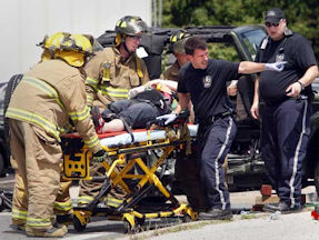 First responders carrying someone on a stretcher