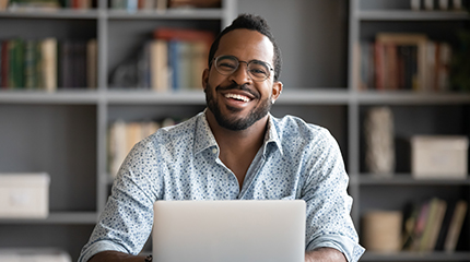 A worker reviews a WHSC occupational health and safety newsletter