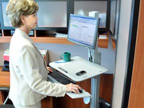 Worker using a standing desk