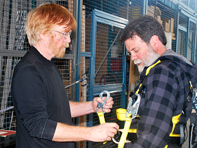 WHSC instructor shows participant the proper way to use a harness