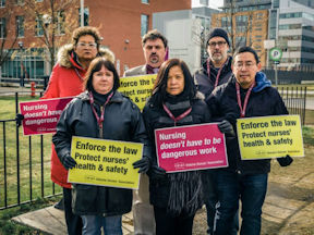 Ontario nurses protesting with signs