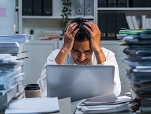Worker suffering from mental fatigue, stress and burnout.