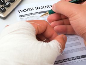 Injured worker completes work injury form