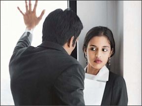 Female worker facing harassment from a male colleague