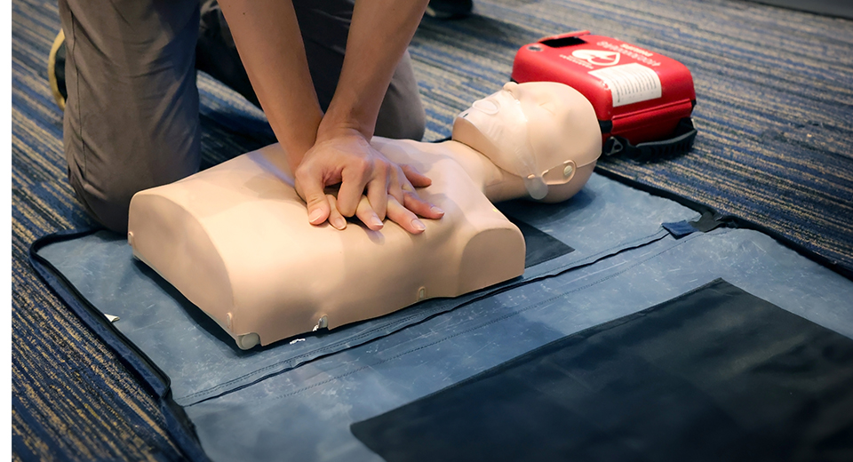 Worker taking first aid and CPR training.
